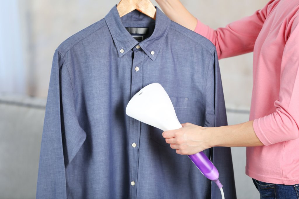Steaming a shirt.